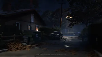 Lamp-lit residential street leading toward the Haddonfield Heights water tower in Halloween: The Game
