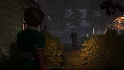 Civilian facing Michael Myers across a hedge at night in Halloween: The Game single-player story mode